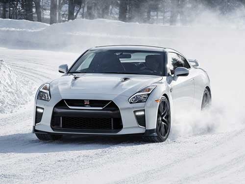 2024 Nissan GT-R driving in snow