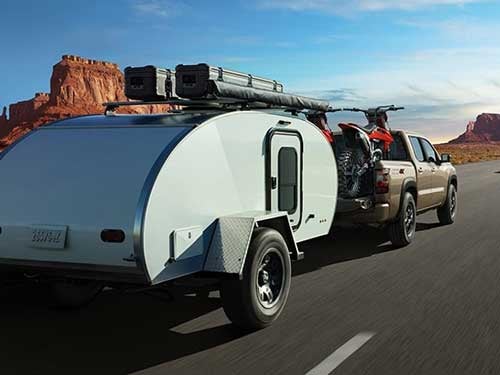 2024 Nissan Frontier towing a camper