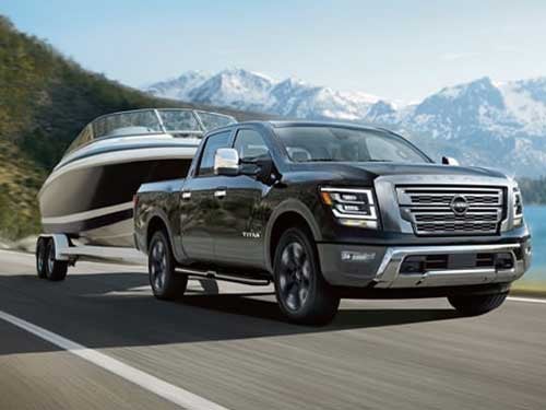 2024 Nissan Titan towing a boat