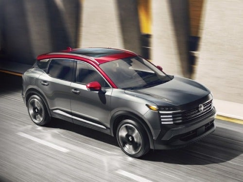 2025 Nissan Kicks driving on a city street