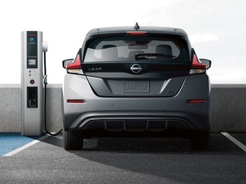 2025 Nissan LEAF rear view of vehicle in a garage charging