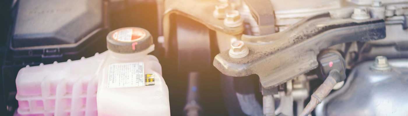 Close up view of a bottle of engine coolant